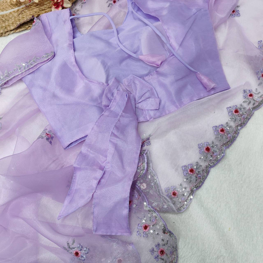 Lavender Organza Silk Saree With Sequence Embroidery Work And Arco Cut Border With Readymade Blouse